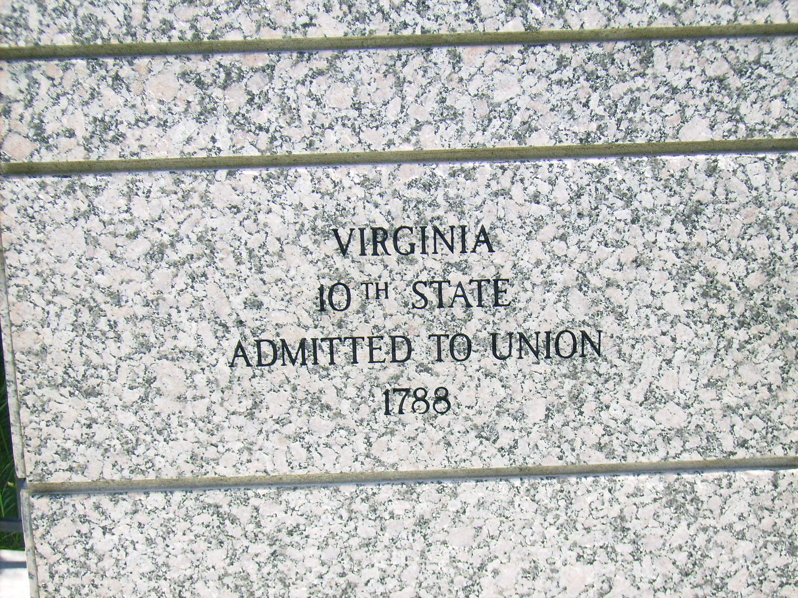 Virginia etched on marble columns at monument entrance